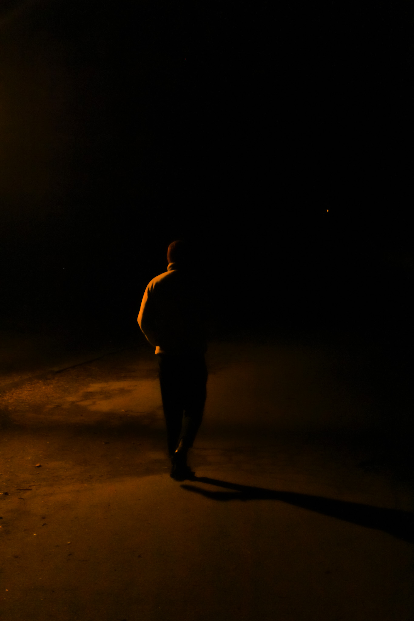 A figure in amber light — photograph by Tony Powers