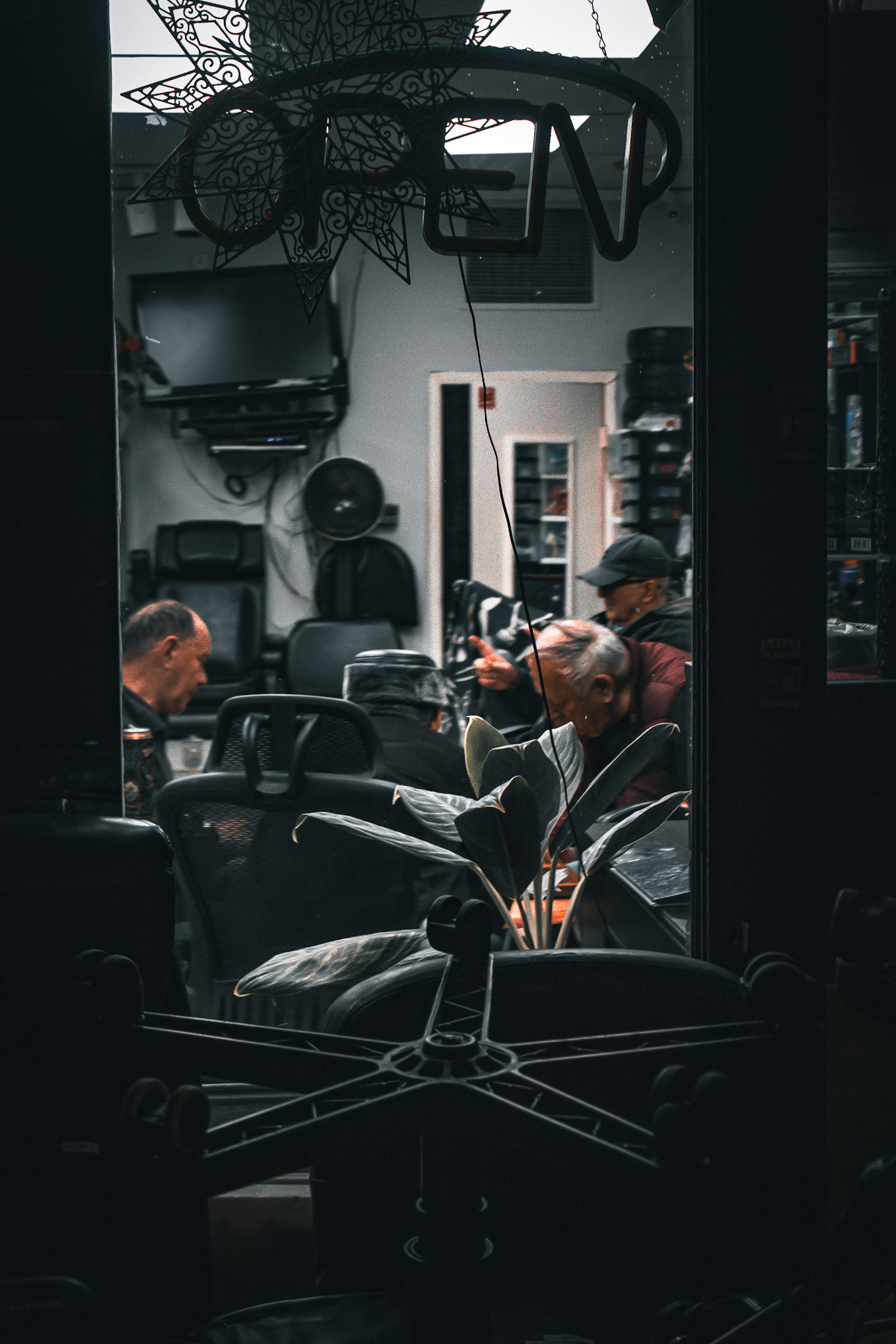 An evening gathering behind glass — photograph by Tony Powers