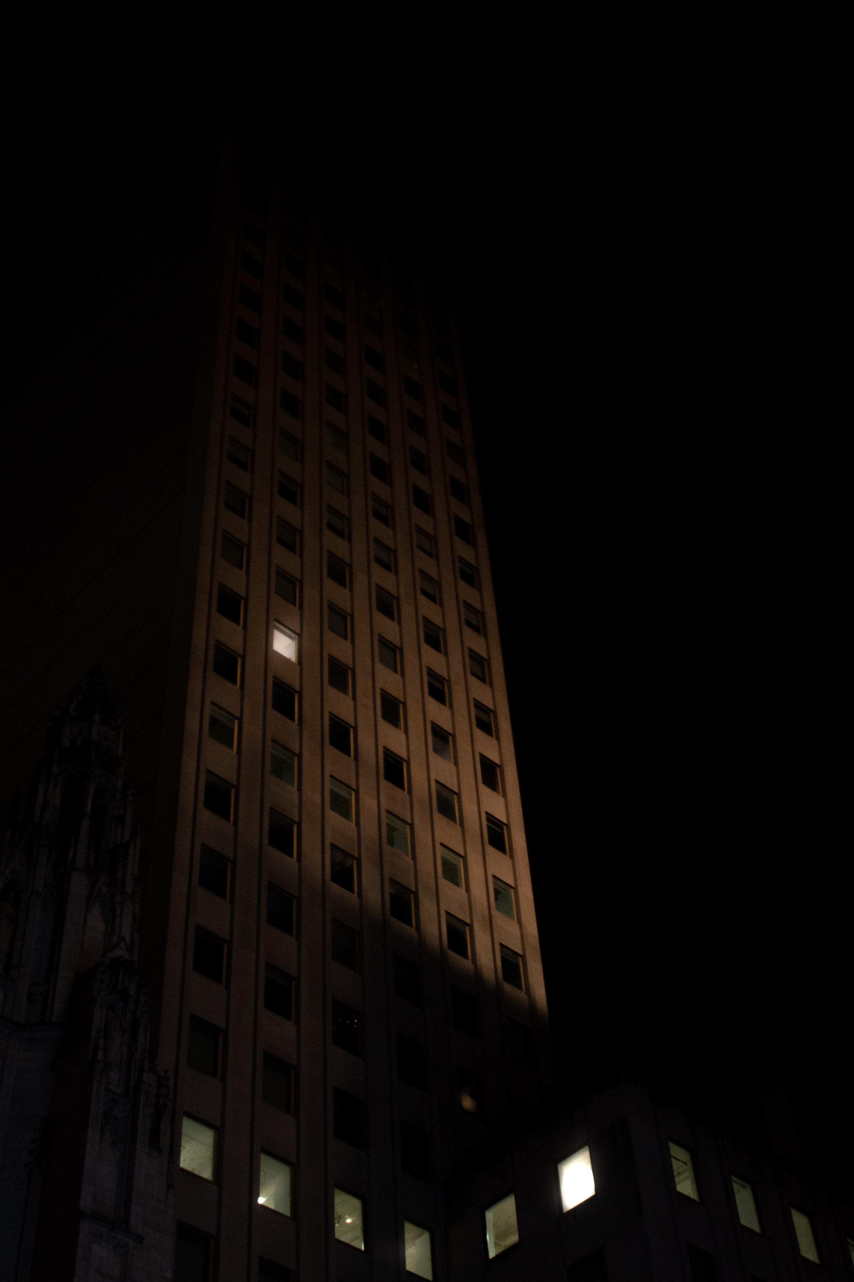 A single window above the city — photograph by Tony Powers