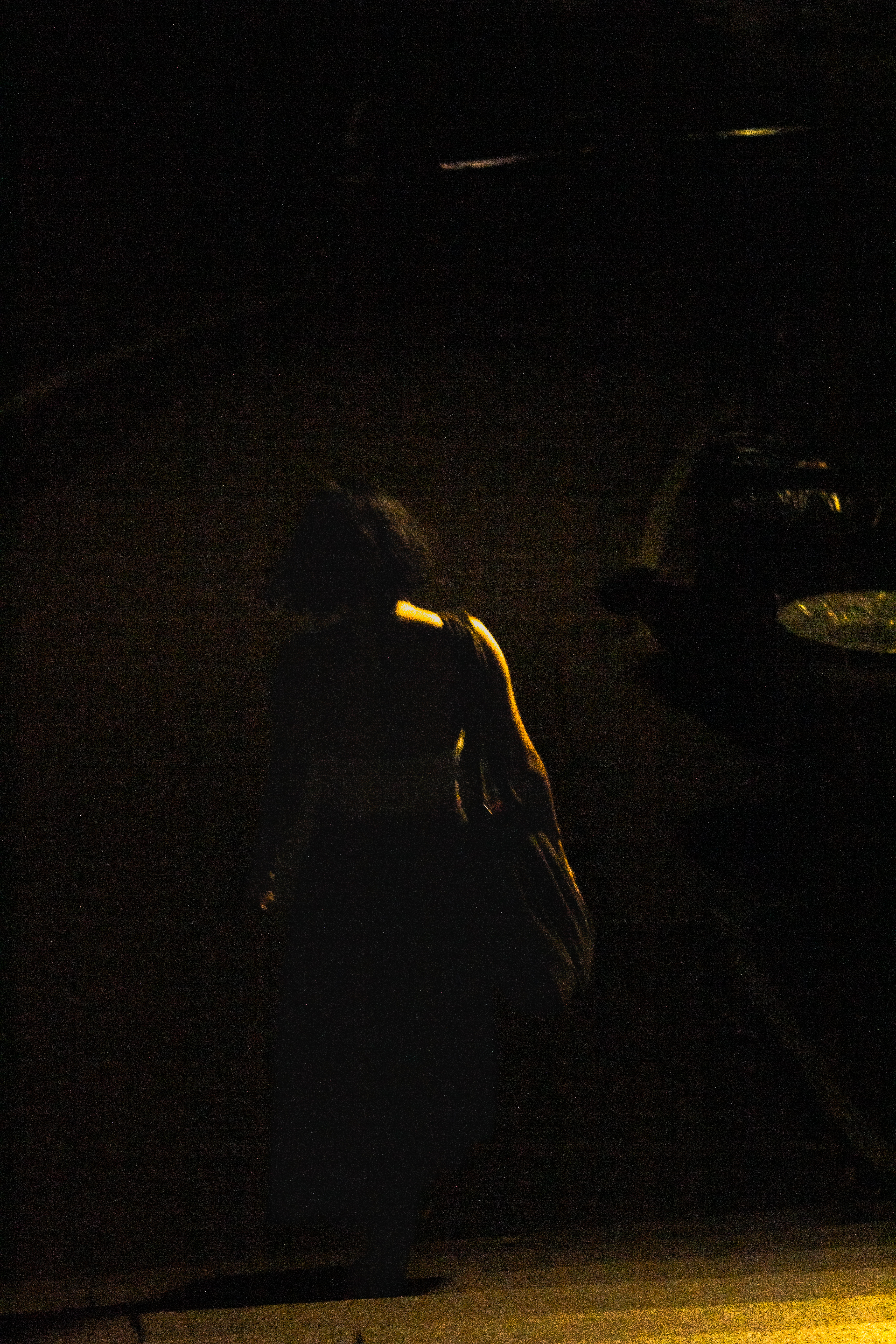 A figure at the edge of light — photograph by Tony Powers